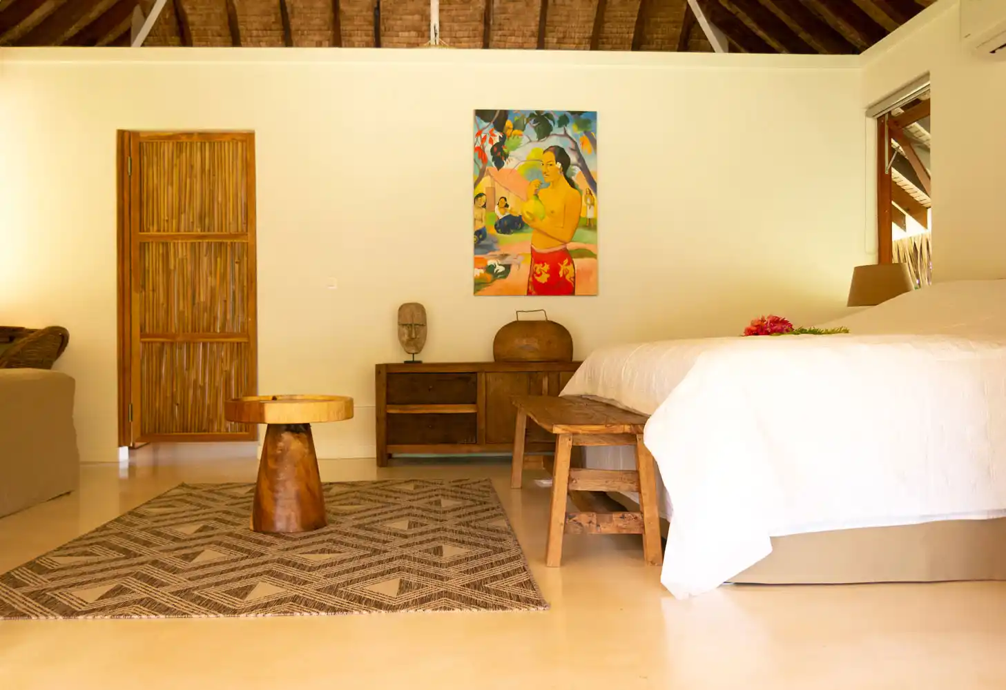 Spacious and welcoming interior view of the bedroom at Fare Kautinaki, offering a haven of peace and comfort at Fare Tiaia Moorea.
